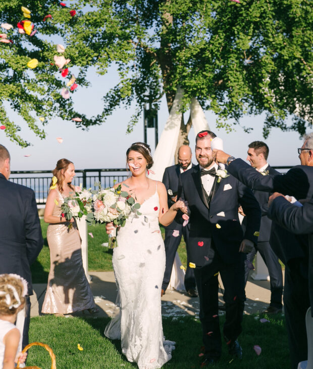 couple celebrating outdaoor ceremony coast weddings