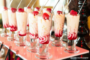 Glasses of Raspberry Cheesecake Cordial on a tray