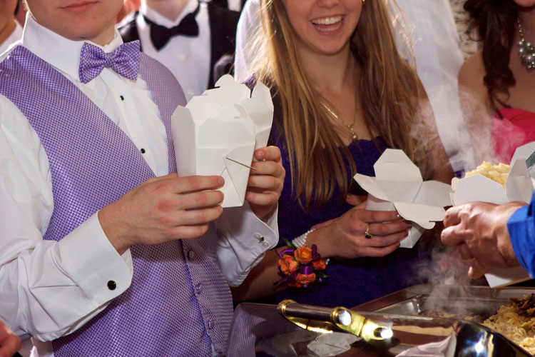 Kids at prom in a buffet line with Chinese take out boxes.