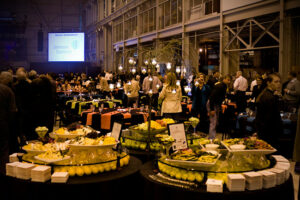 Tables set with salads and appetizers during an event.