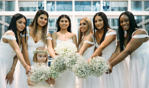 Bride and her bridesmaids all in white.