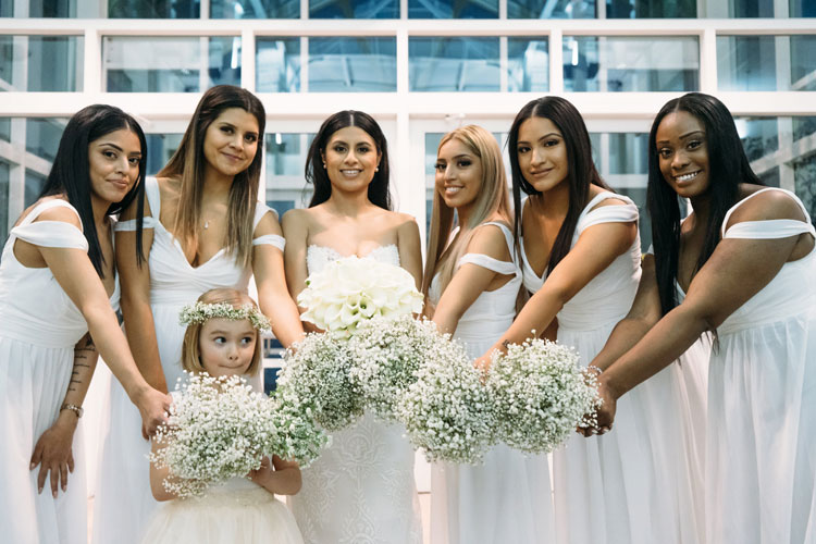 Bride and her bridesmaids all in white.