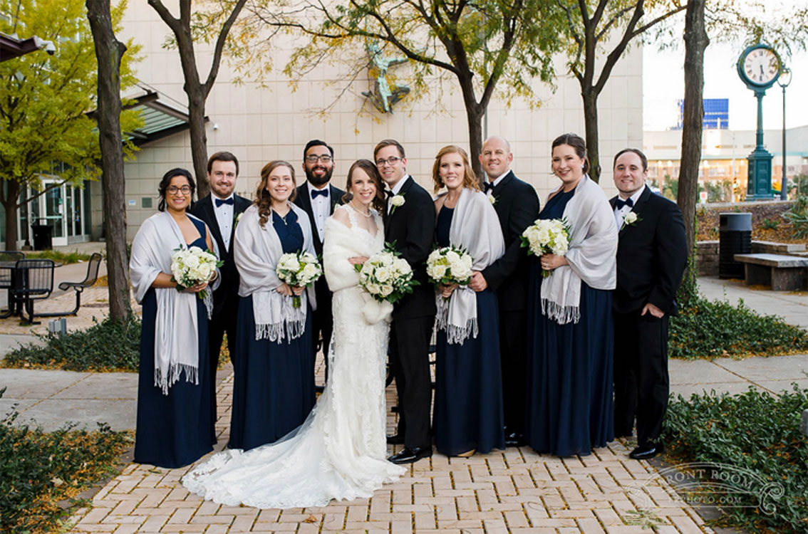 Wedding party posing outside of The Milwaukee Public Museum.