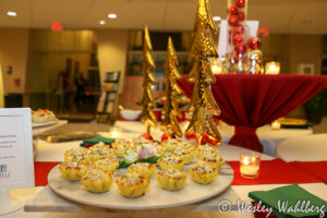 Table set with appetizers and holiday decor.