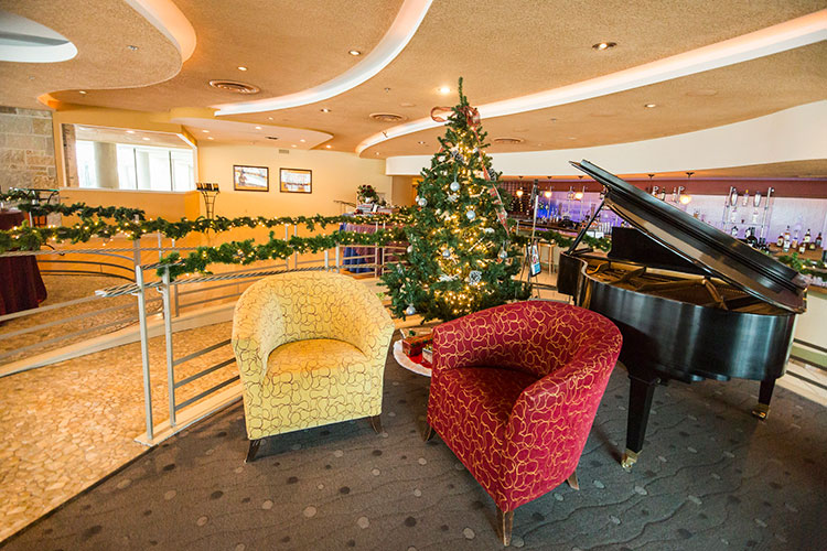 Piano and two chairs at Coast.