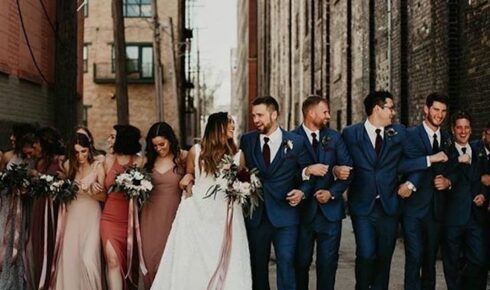 bridal party walking down the sidewalk