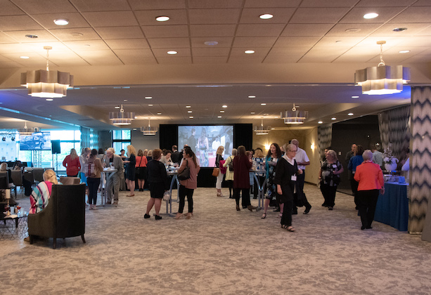 People milling around during a conference.