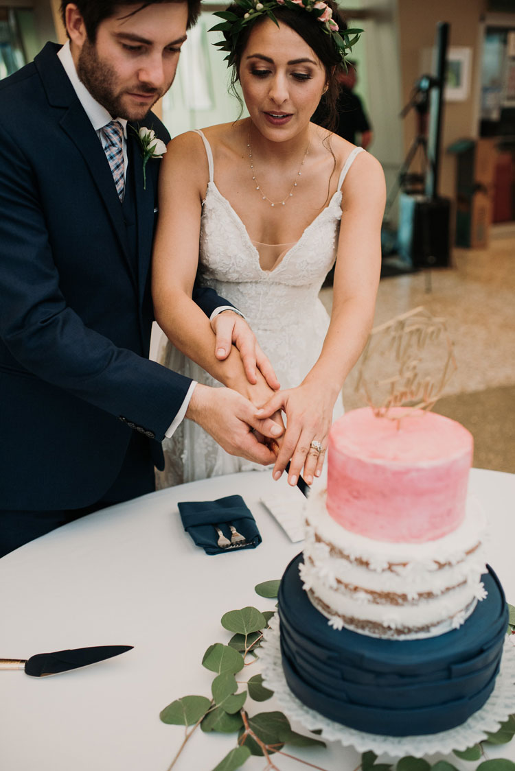 Bride and Groom Cut Cake at Domes Wedding