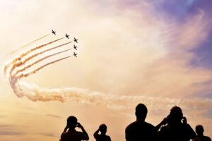 People watching a air show.