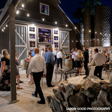 Wedding guests milling around outside of Lilac Acres