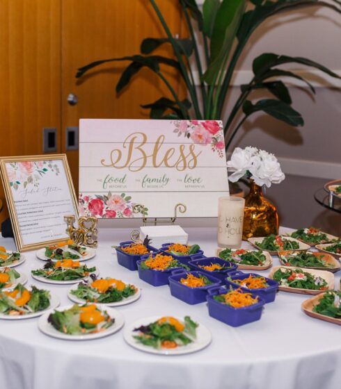 Plated salads set up on a table.
