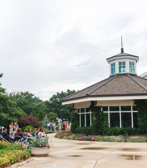 Wedding guests milling around outside of Boerner Botanical Gardens.