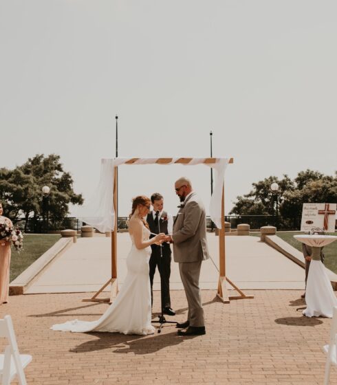 Bride and groom saying their vows at an outdoor ceremony at Zilli Lake and Gardens.