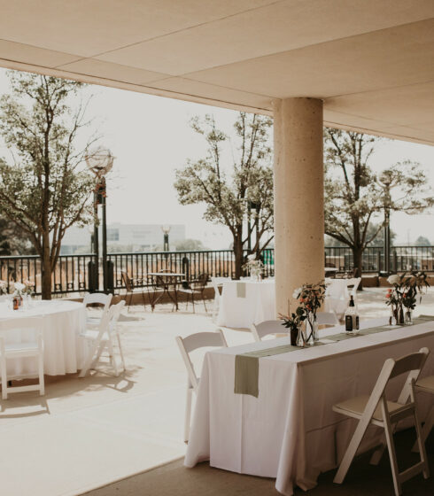 Reception tables set up on the balcony Zilli Lake and Gardens.