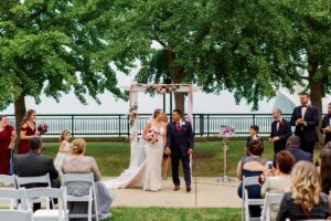 A bride and groom walking back up the isle after getting married.