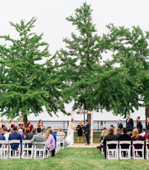 Outdoor wedding ceremony in front of trees