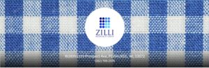 Zilli logo over blue plaid