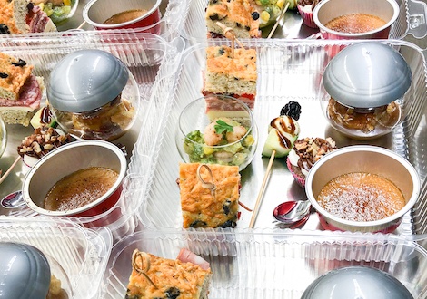 Boxed lunches being prepared on a table