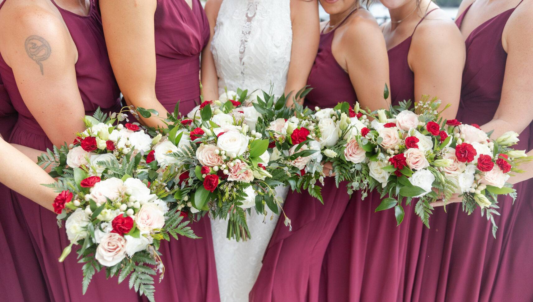 bridesmaids and bride holding bouquets