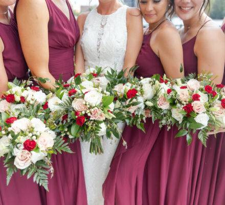 bridesmaids and bride holding bouquets