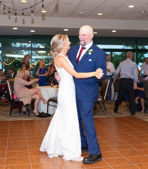 bride dancing with father on wedding day