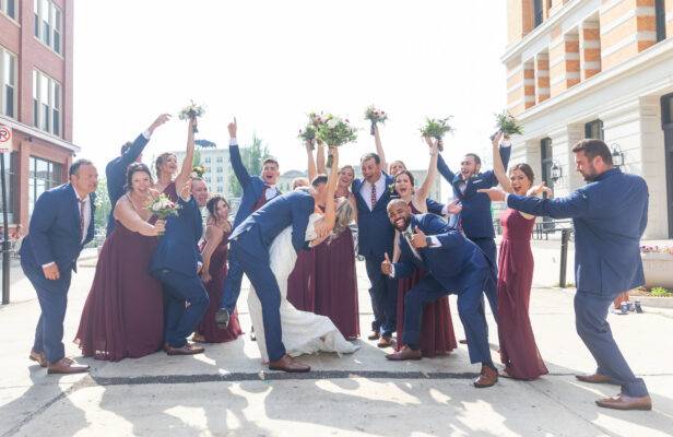 wedding party celebrating couple on wedding day