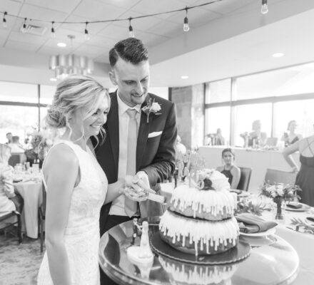 wedding couple cutting their Bundt wedding cake