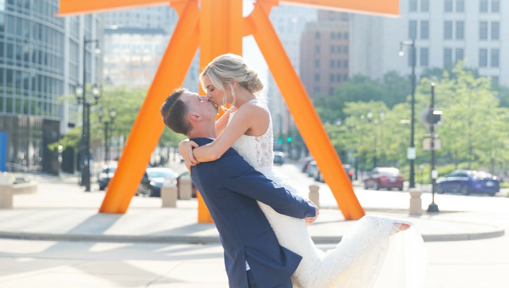 couple kissing outside on their wedding day