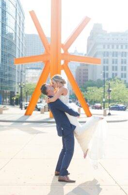 couple kissing outside on their wedding day