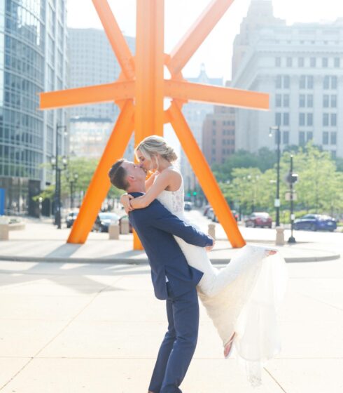 couple kissing outside on their wedding day