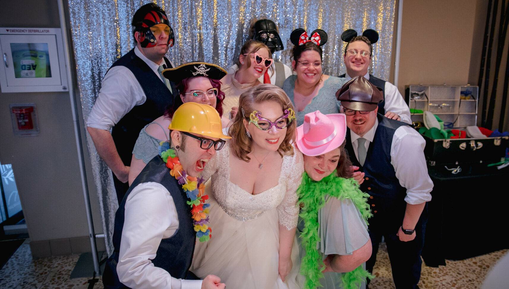 group photo with a photo booth at a wedding