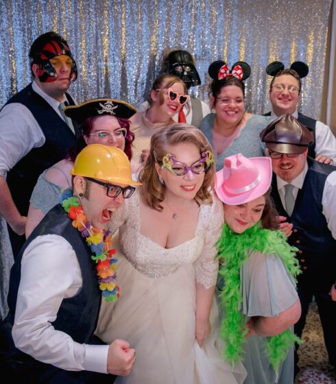 group photo with a photo booth at a wedding