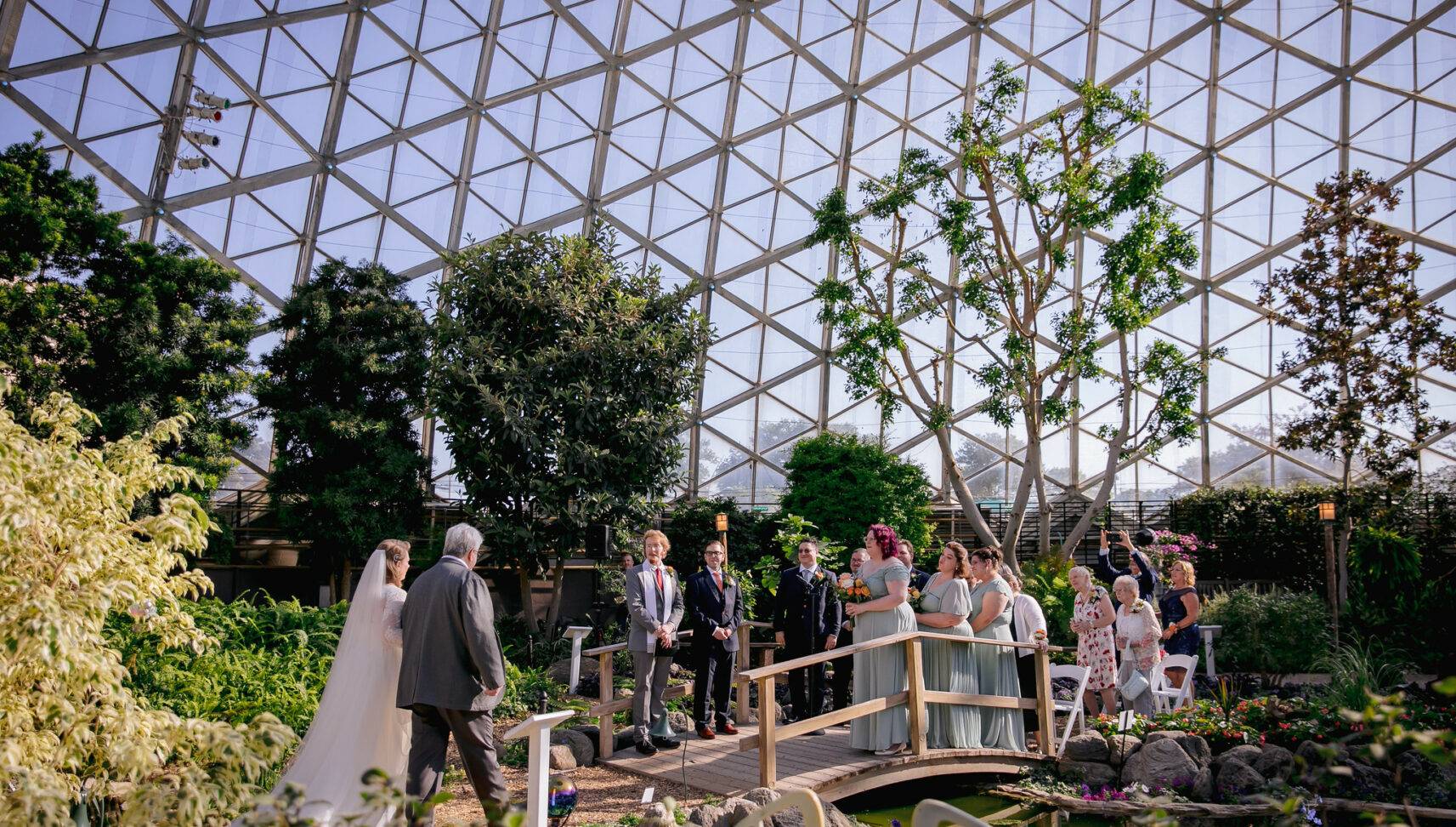 bride and her father approaching altar at milwaukee domes