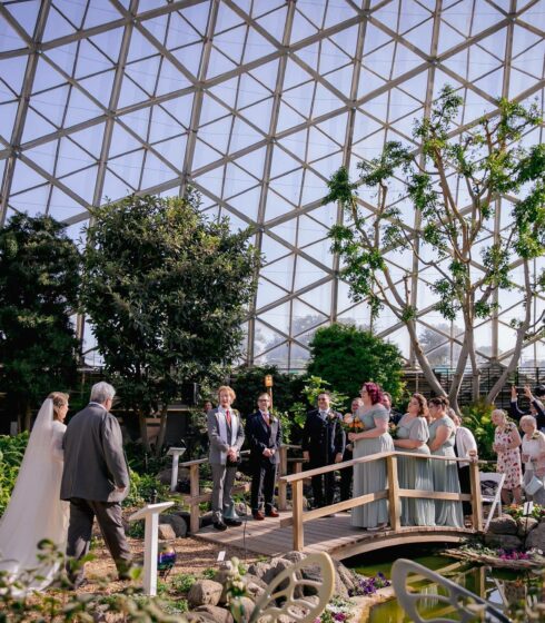 bride and her father approaching altar at milwaukee domes