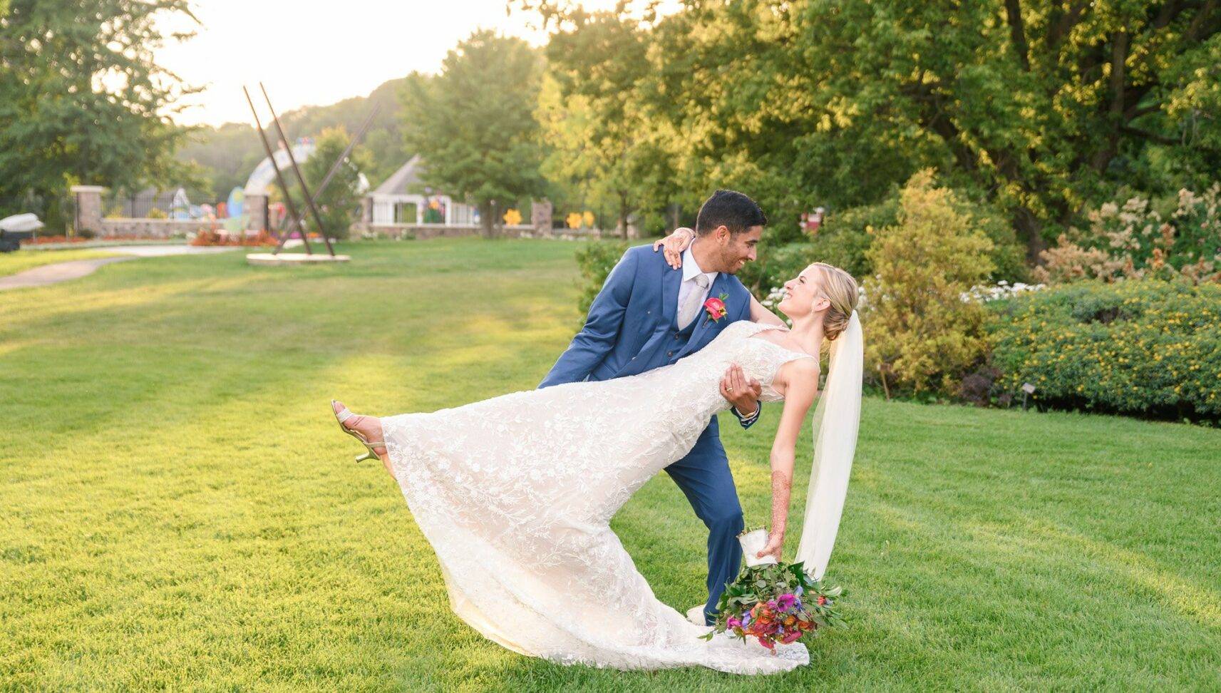 groom dipping bride at wedding