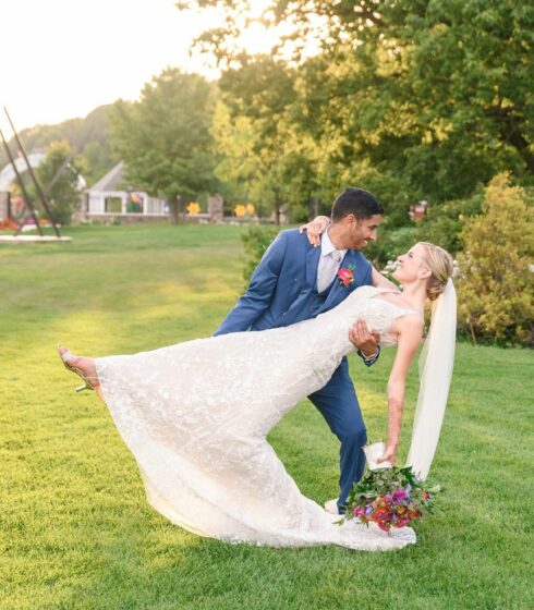 groom dipping bride at wedding