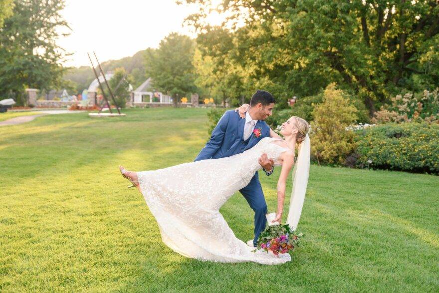groom dipping bride at wedding