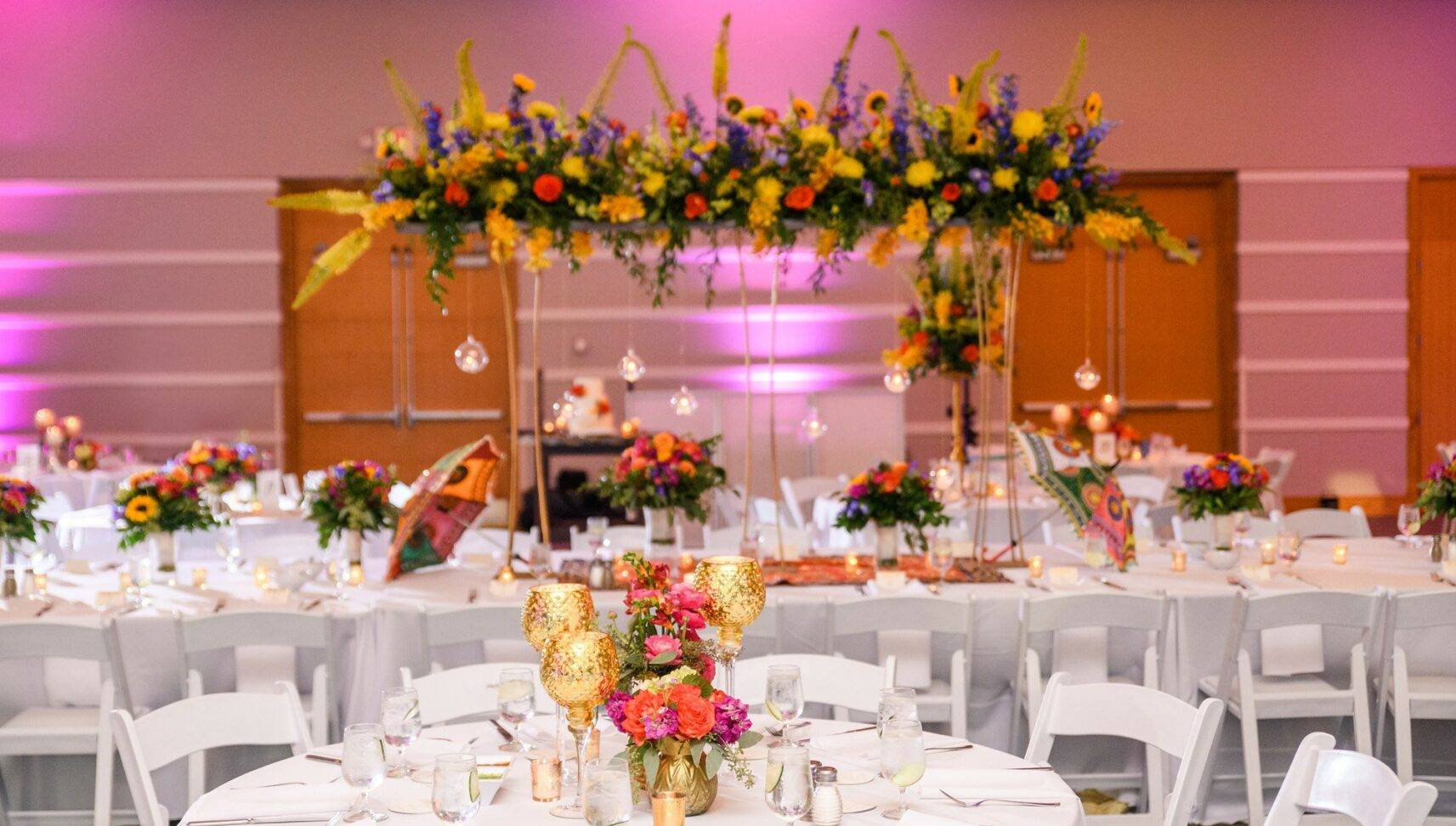 wedding reception setup with a lot of florals