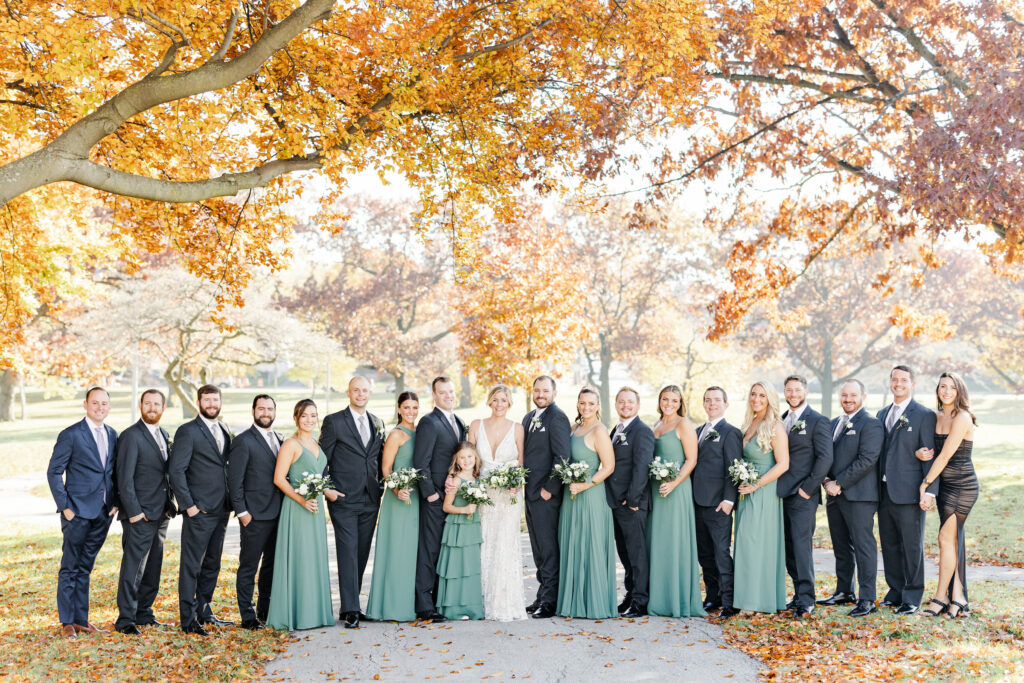 Bridal party under the fall trees.