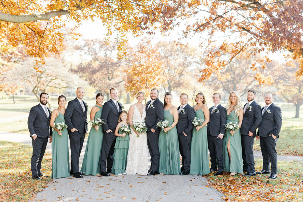 Bridal party under the fall trees.