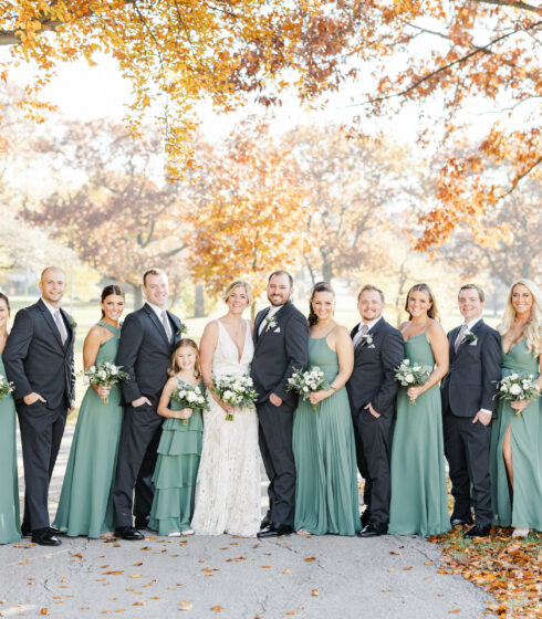 Bridal party under the fall trees.