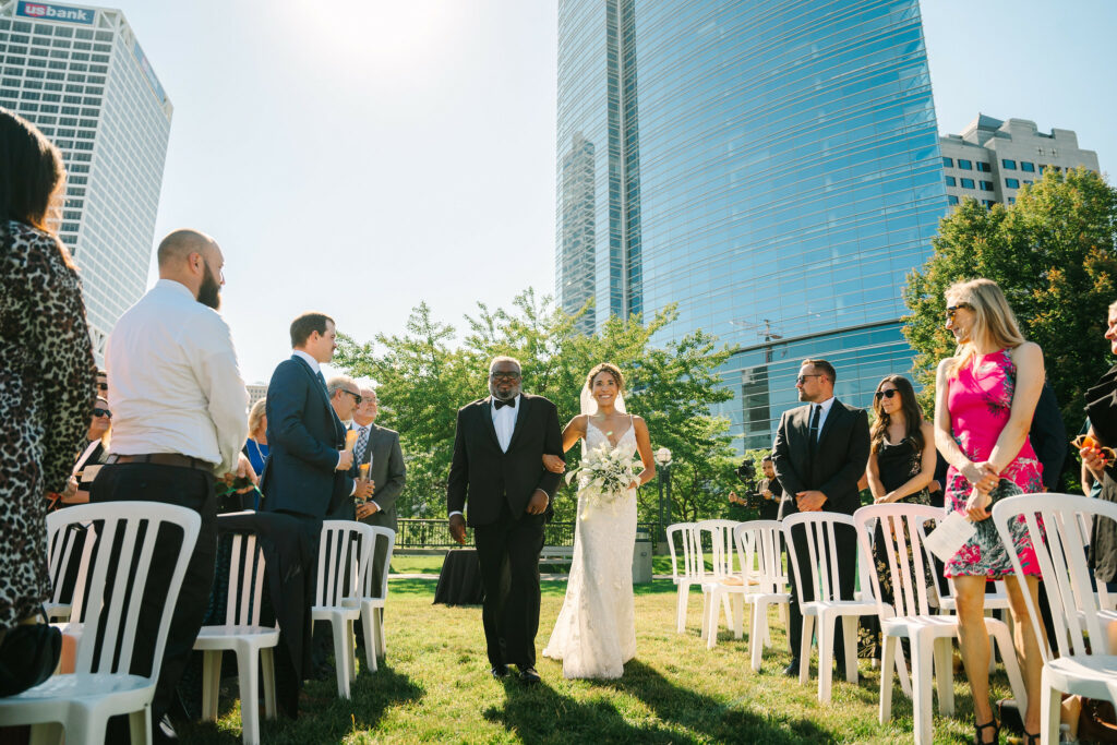 bride walking down the aisle with father