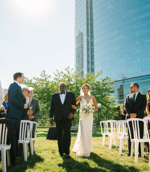 bride walking down the aisle with father