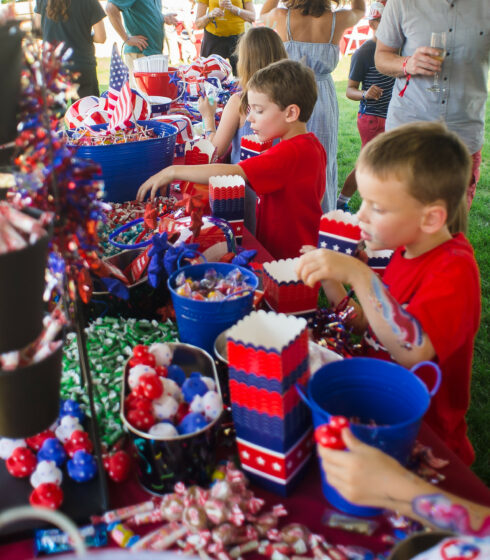 kids grabbing candy from display