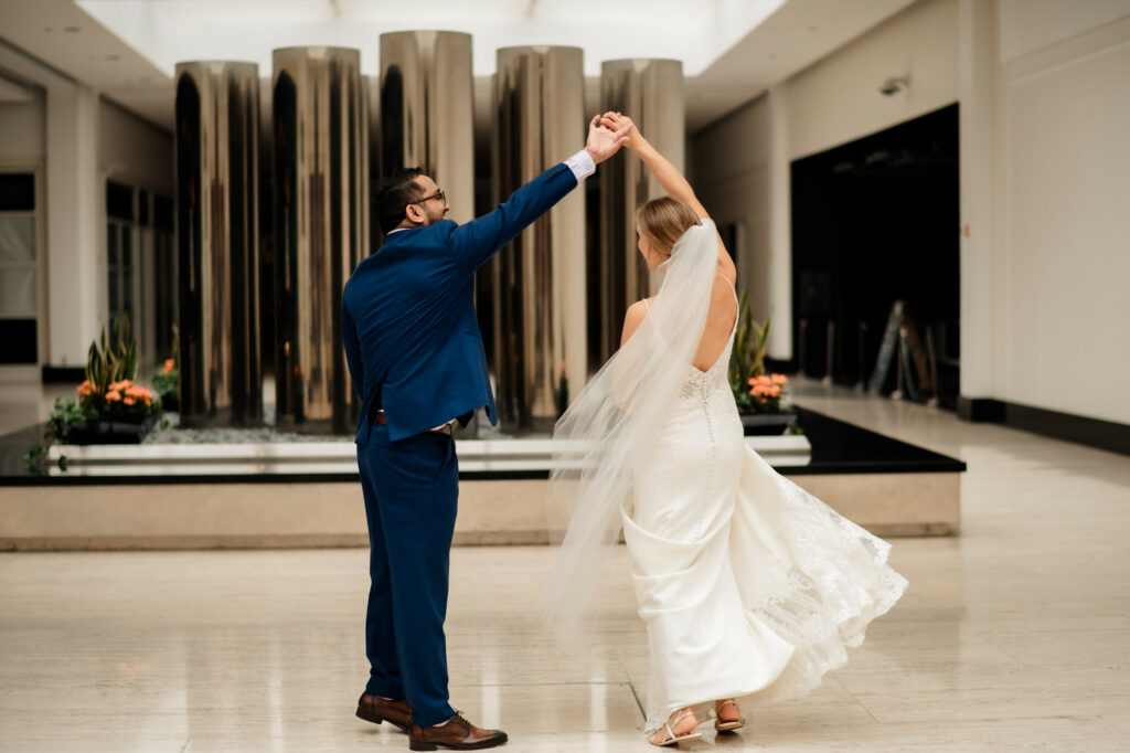 groom spinning bride