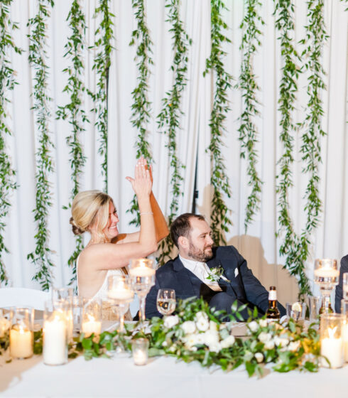 couple and bridal party at head table.