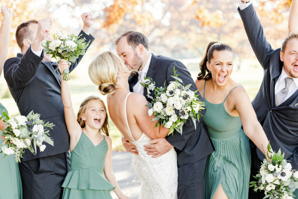 Couple in surrounded by bridal party.