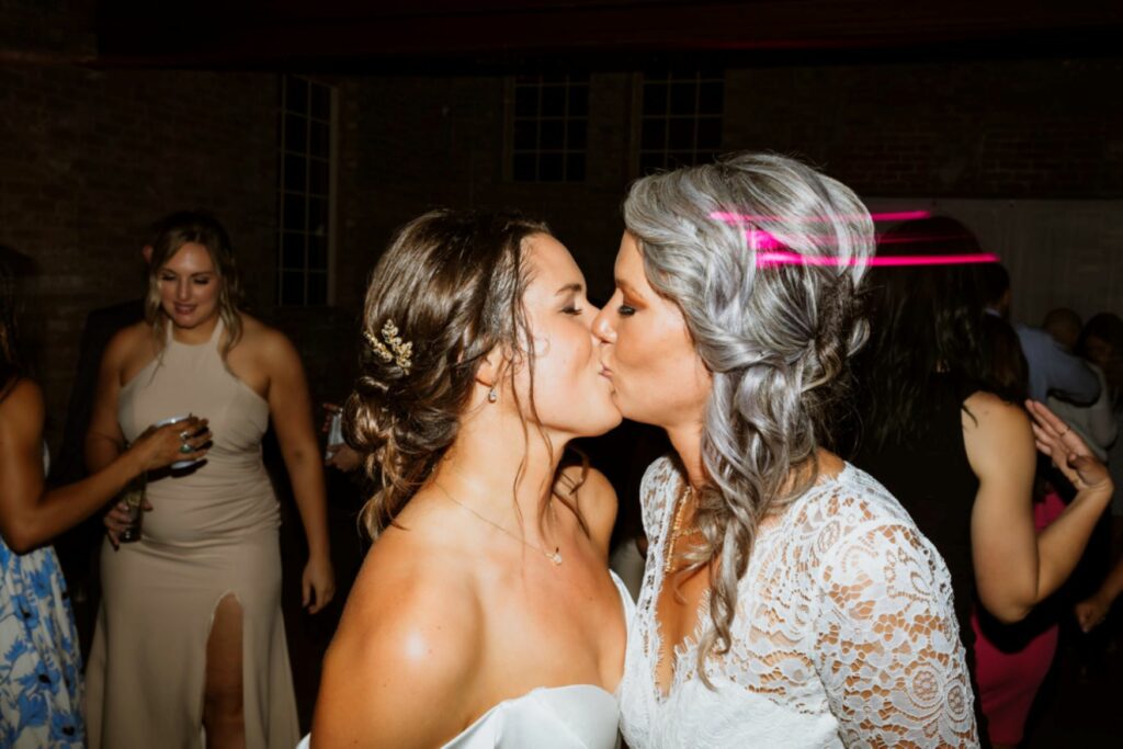 couple kissing on wedding day