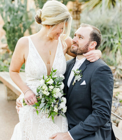 Couple sitting in embrace .