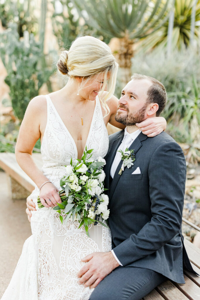 Couple sitting in embrace .
